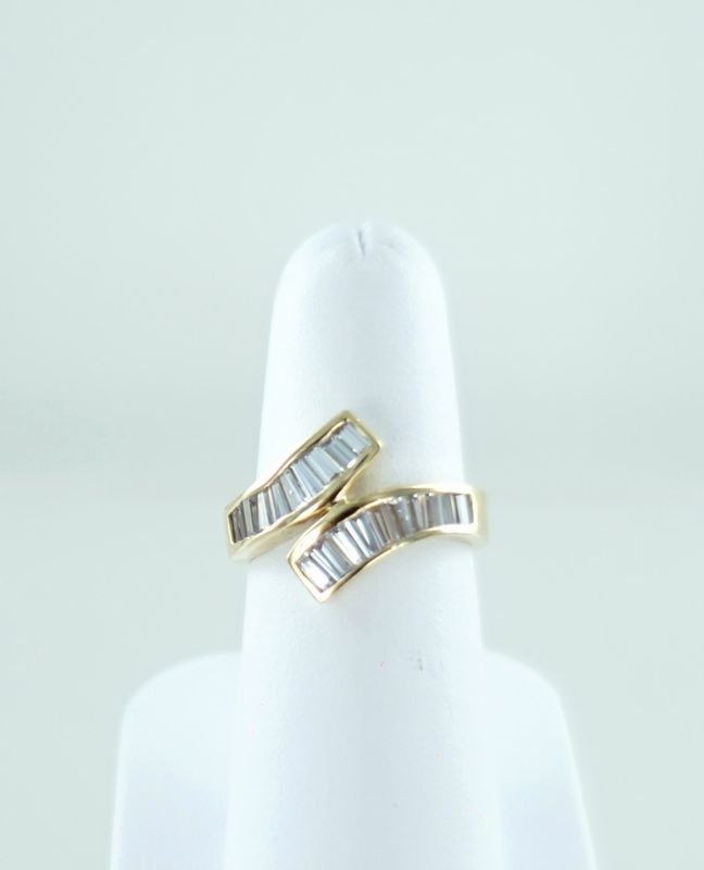 14KT YELLOW GOLD BAGUETTE WHITE STONES BYPASS RING SIZE 7.5